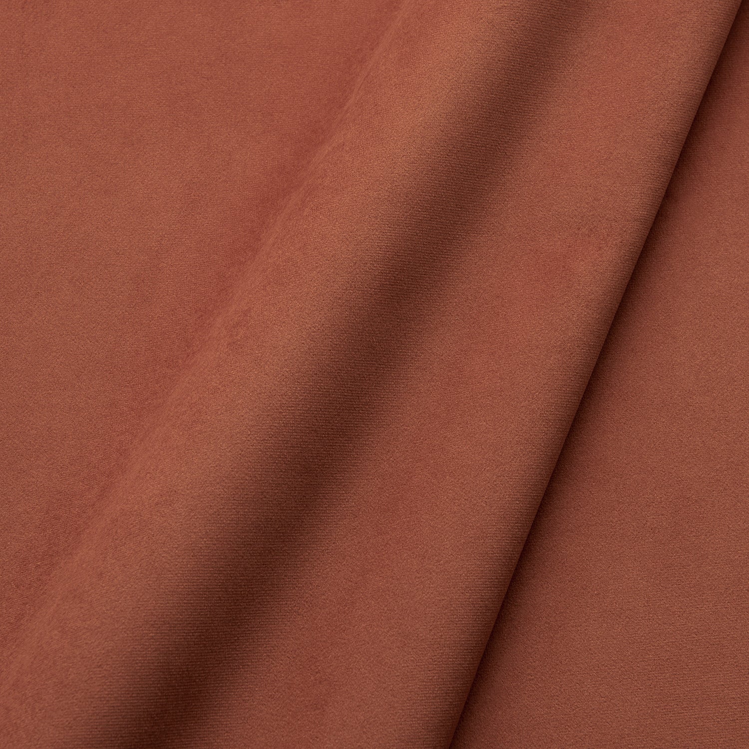 Fabric swatch of a plain stain resistant velvet upholstery fabric in a terracotta colour