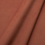 Fabric swatch of a plain stain resistant velvet upholstery fabric in a terracotta colour