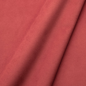 Fabric swatch of a plain stain resistant velvet upholstery fabric in a coral colour