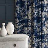 Curtain in a printed velvet fabric showcasing a rich, tropical-style toile in Indigo.