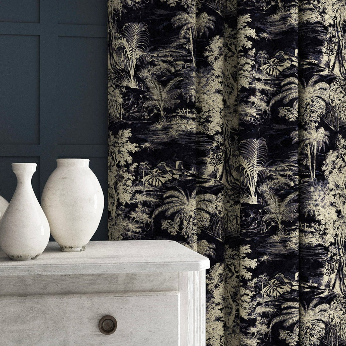 Curtain in a printed velvet fabric featuring a rich, tropical-style toile in dark grey.