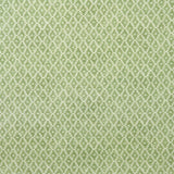 Fabric sample of a green and neutral printed linen fabric with a geometric pattern