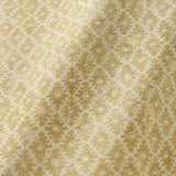 Fabric sample of a yellow and neutral printed linen fabric with a geometric pattern