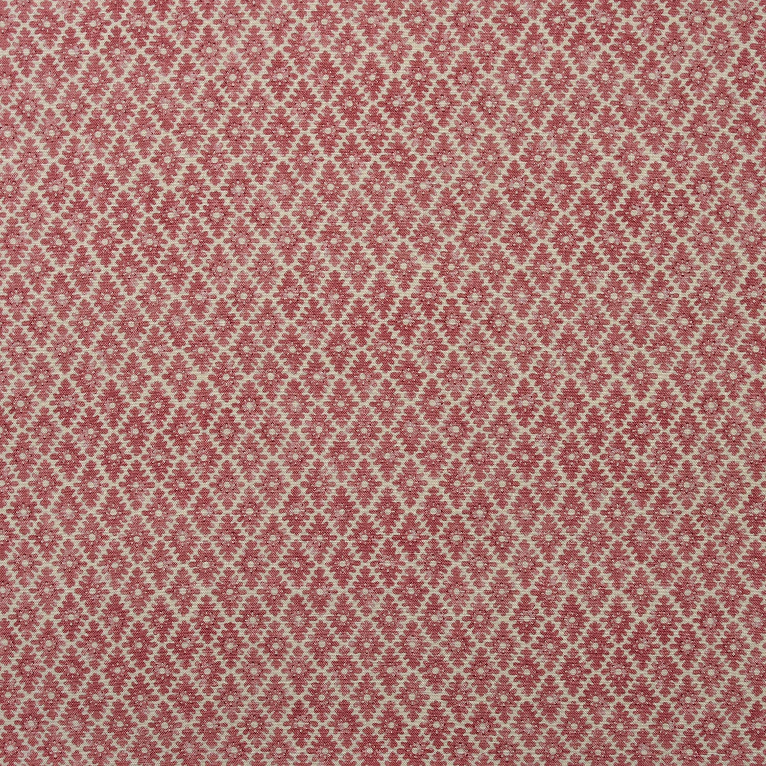 Fabric sample of a red and neutral printed linen fabric with a geometric pattern