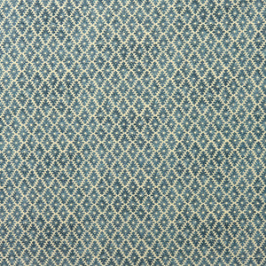 Fabric sample of a blue and neutral printed linen fabric with a geometric pattern