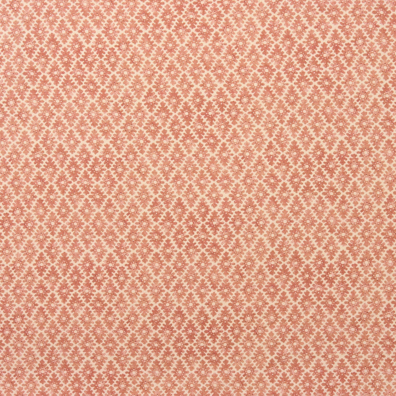 Fabric sample of a orange and neutral printed linen fabric with a geometric pattern