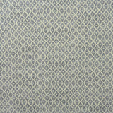 Fabric sample of a blue and neutral printed linen fabric with a geometric pattern