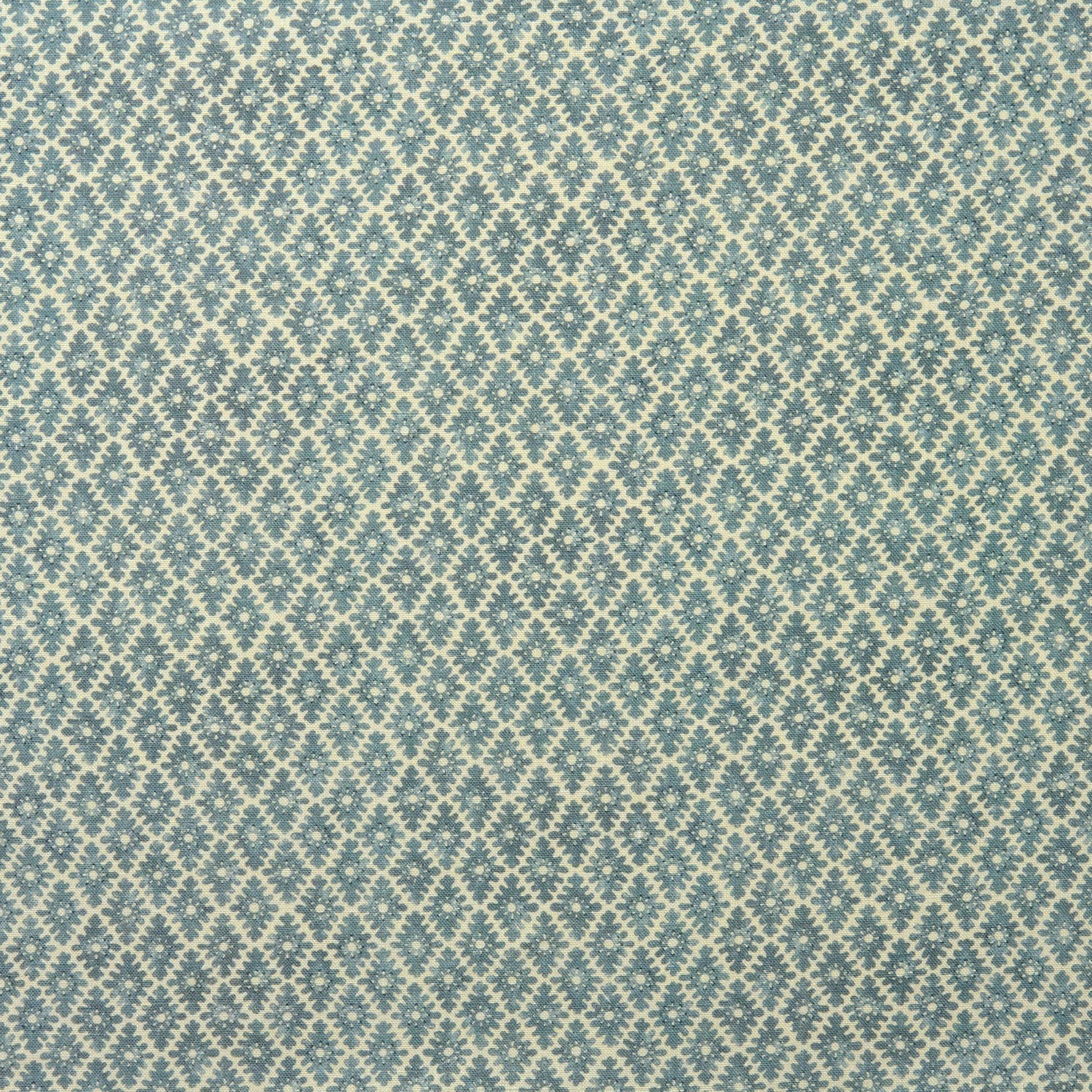 Fabric sample of a blue and neutral printed linen fabric with a geometric pattern