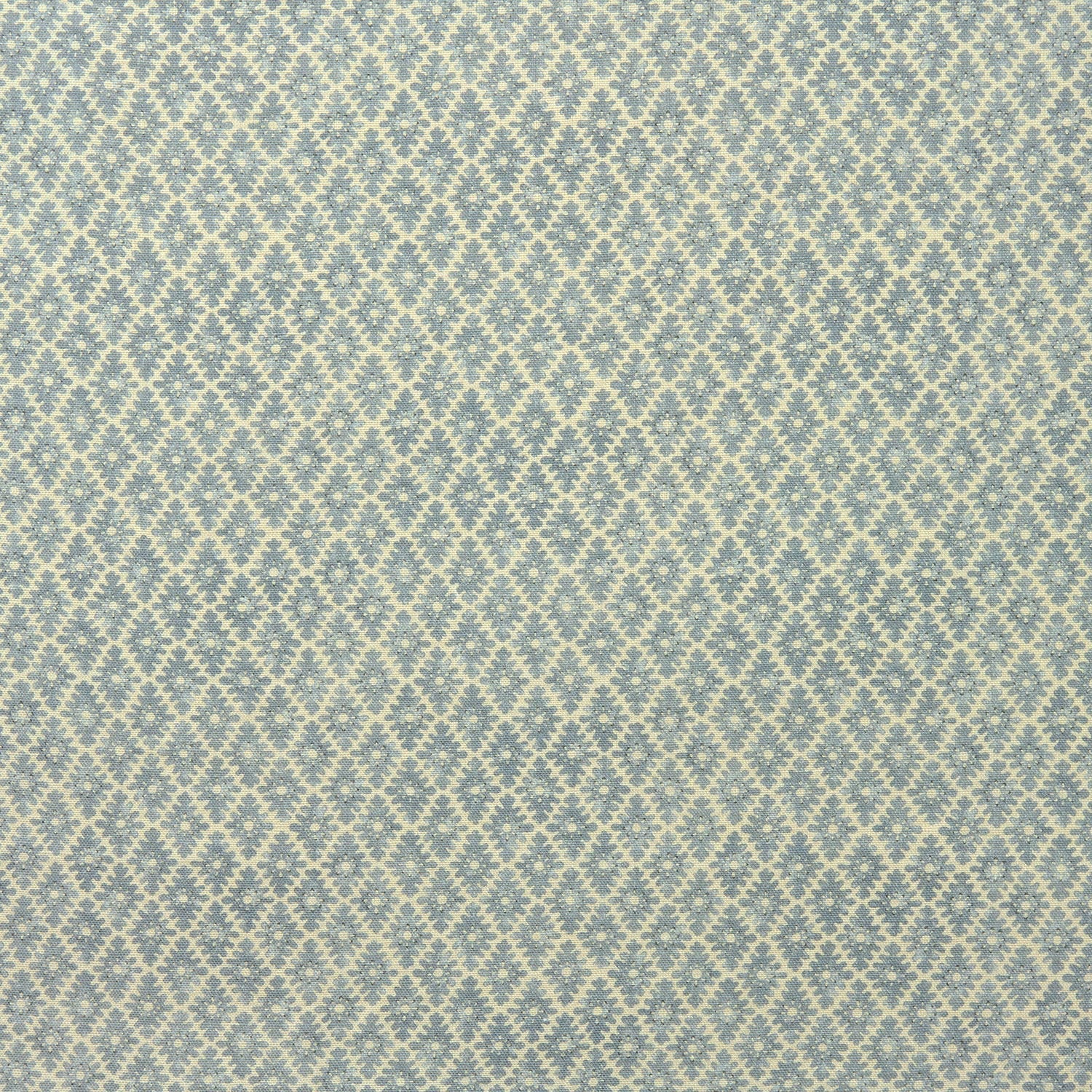 Fabric sample of a blue and neutral printed linen fabric with a geometric pattern