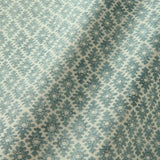 Fabric sample of a blue and neutral printed linen fabric with a geometric pattern