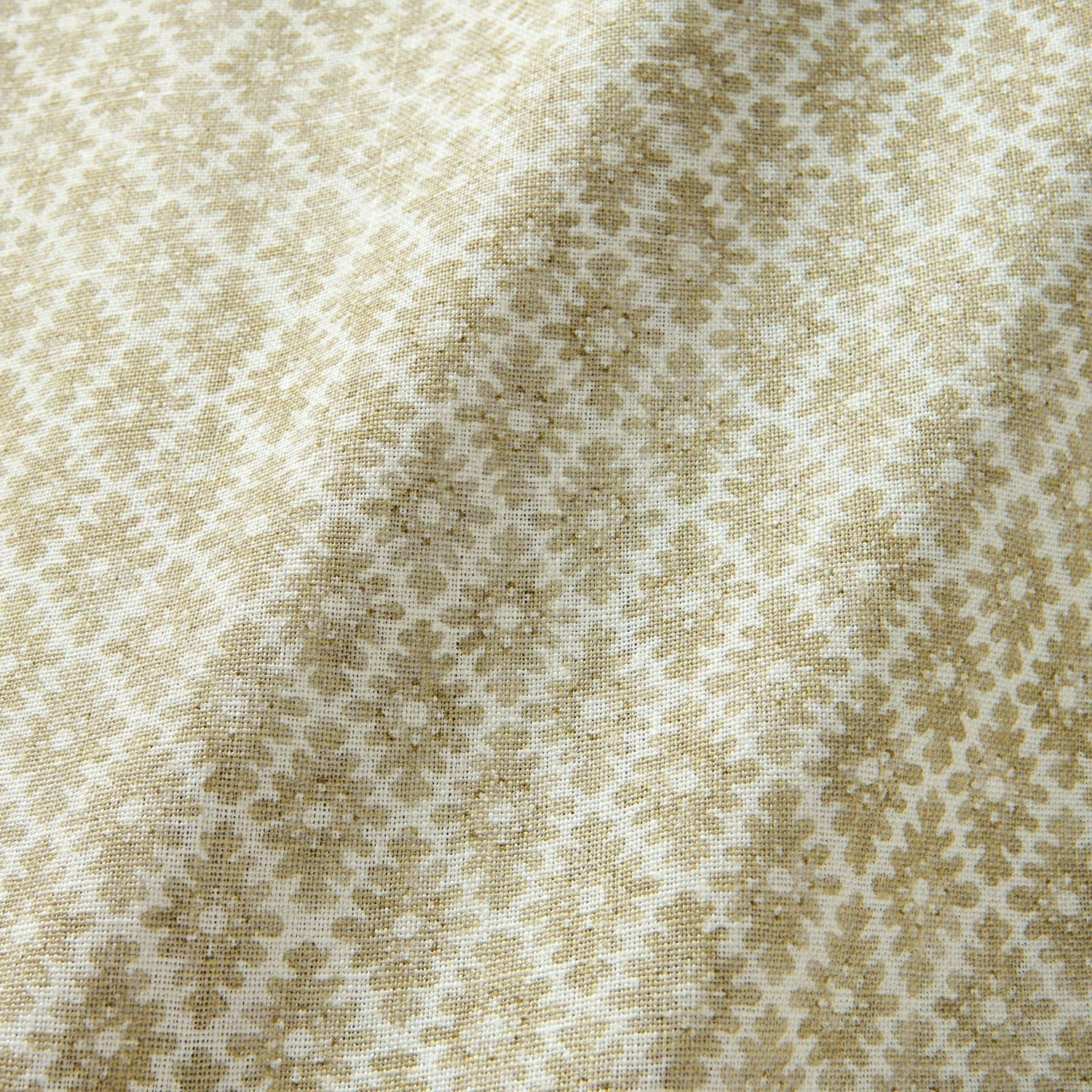 Fabric sample of a yellow and neutral printed linen fabric with a geometric pattern