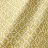 Fabric sample of a yellow and neutral printed linen fabric with a geometric pattern