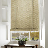 Blind in a yellow and neutral printed linen fabric with a geometric pattern