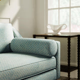 Sofa upholstered in a blue and neutral printed linen fabric with a geometric pattern