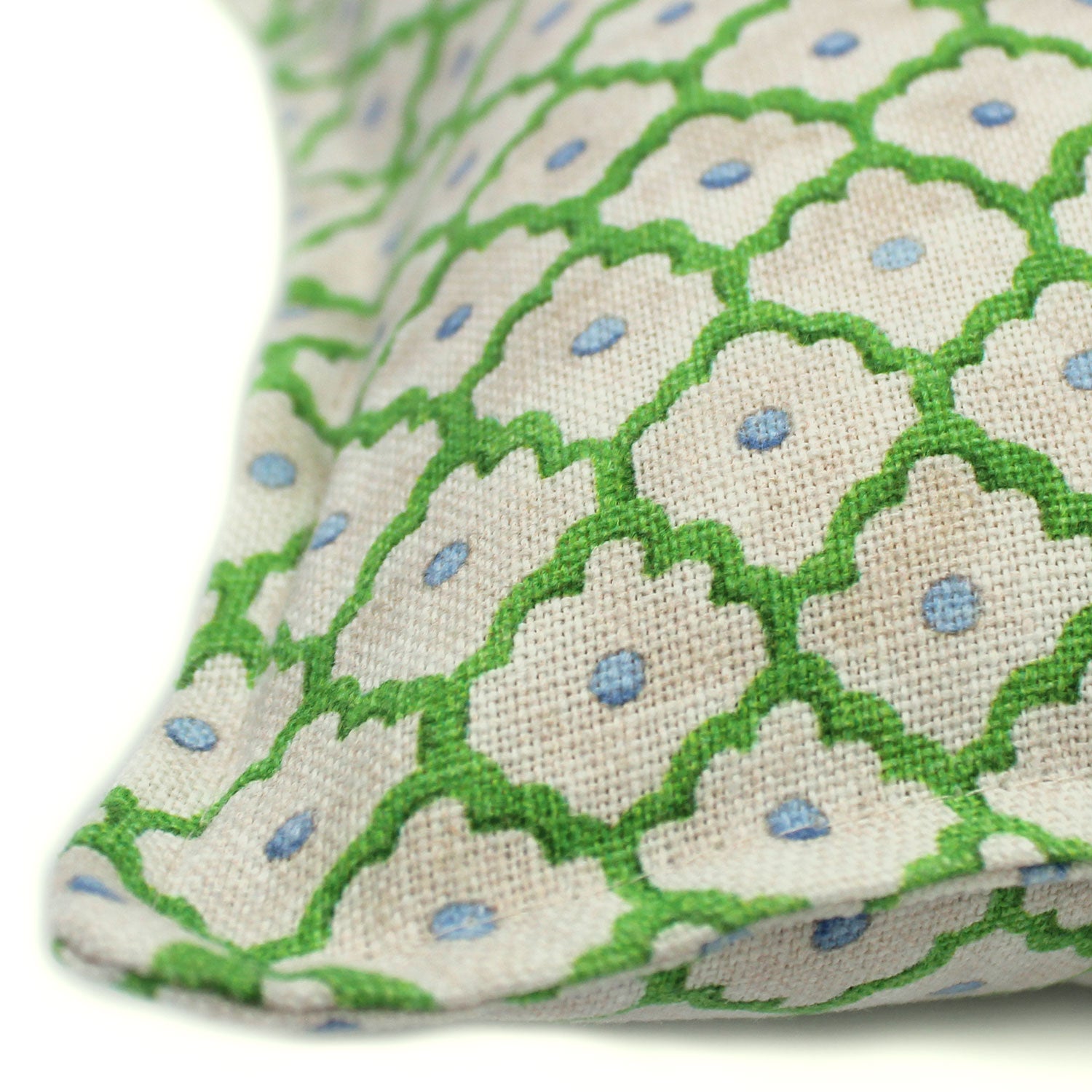 A green, blue and cream linen cushion with a trellis pattern.