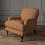 Orange chair upholstered in a herringbone pure wool woven fabric.