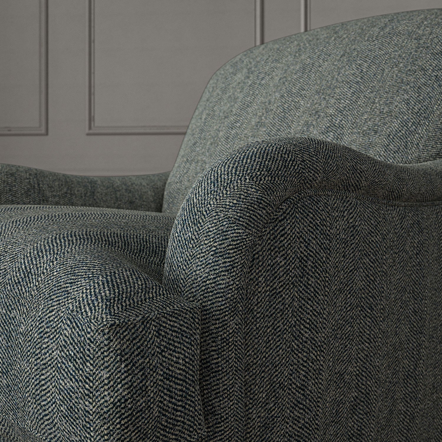 Blue chair upholstered in a herringbone pure wool woven fabric.