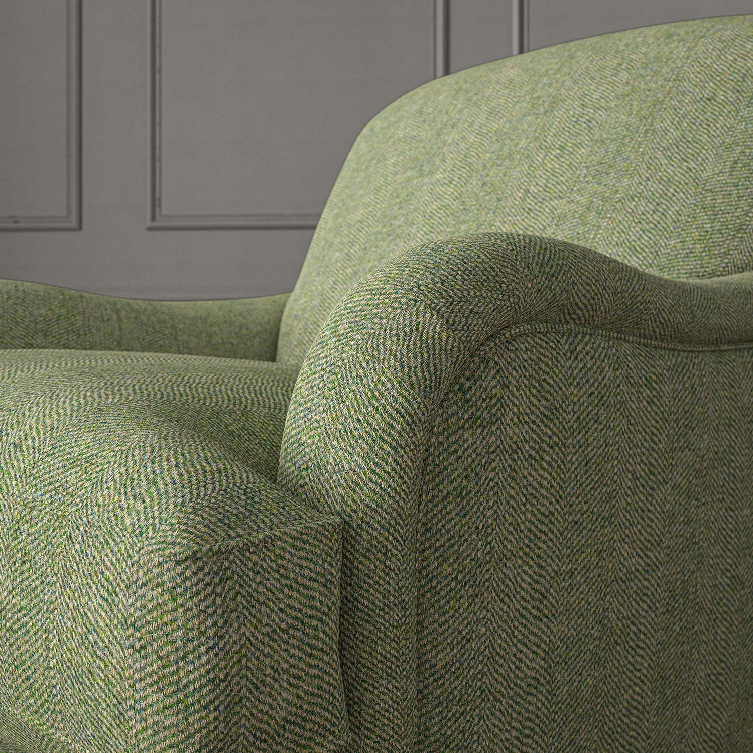 Green chair upholstered in a herringbone pure wool woven fabric.