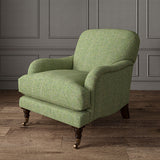 Green chair upholstered in a herringbone pure wool woven fabric.