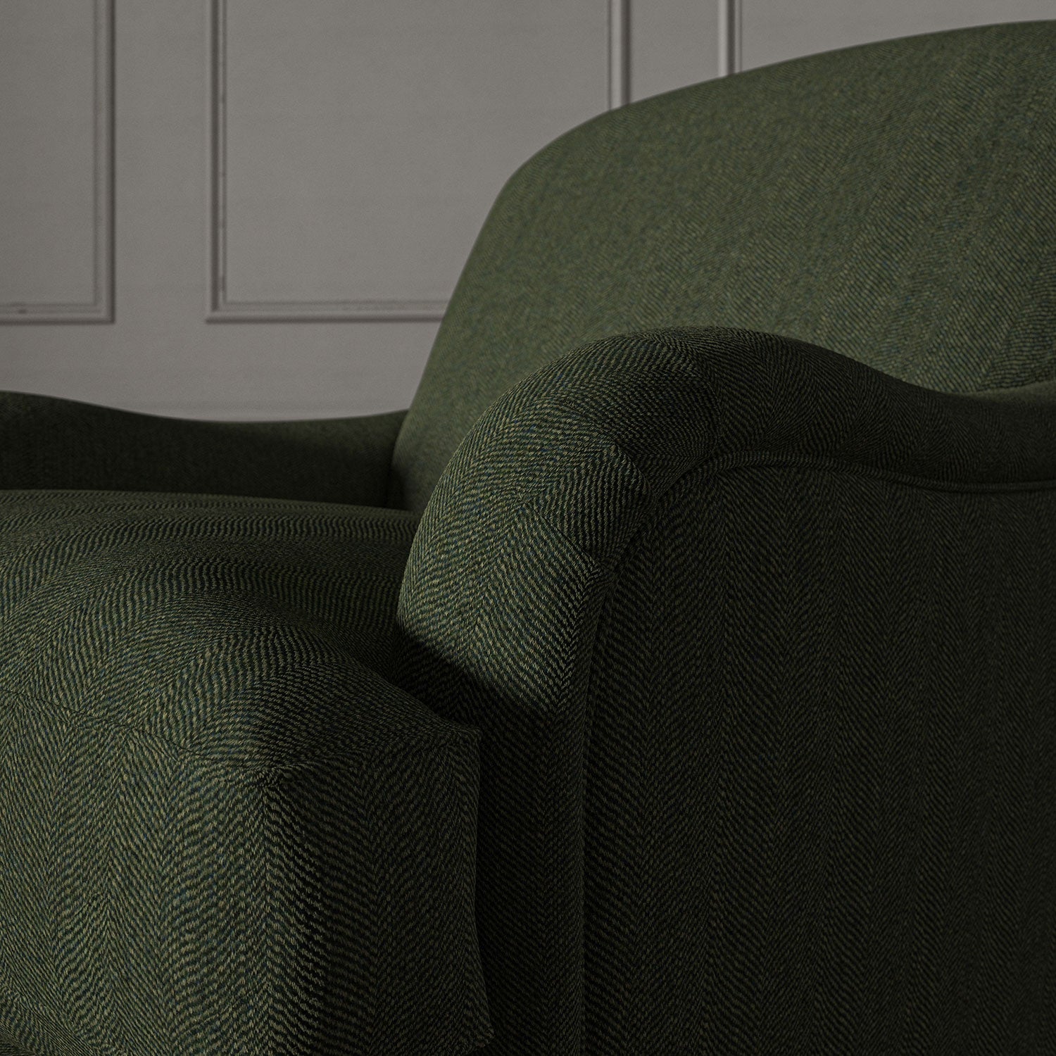 Green chair upholstered in a herringbone pure wool woven fabric.