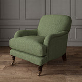 Green chair upholstered in a herringbone pure wool woven fabric.