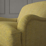 Yellow chair upholstered in a herringbone pure wool woven fabric.