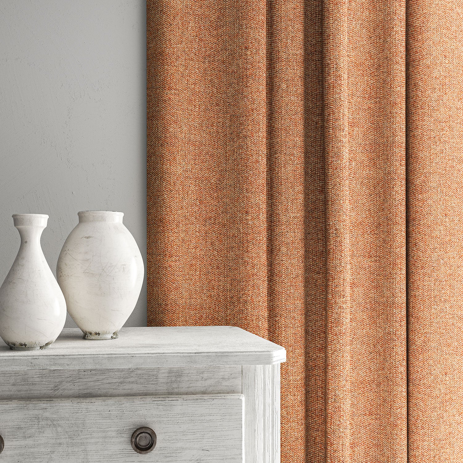 Orange curtain made from a herringbone pure wool woven fabric.