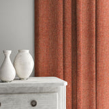 Red curtain made from a herringbone pure wool woven fabric.