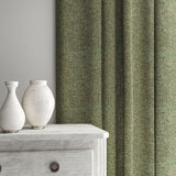 Grey curtain made from a herringbone pure wool woven fabric.