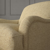 Brown chair upholstered in a plain pure wool woven fabric.