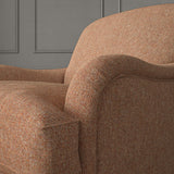 Orange chair upholstered in a plain pure wool woven fabric.