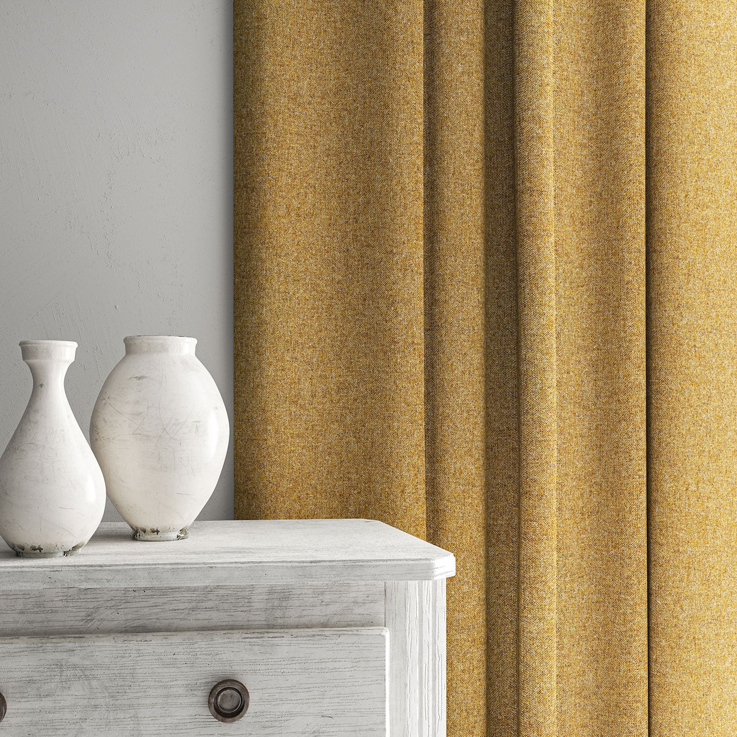 Yellow curtain made from a plain pure wool woven fabric.