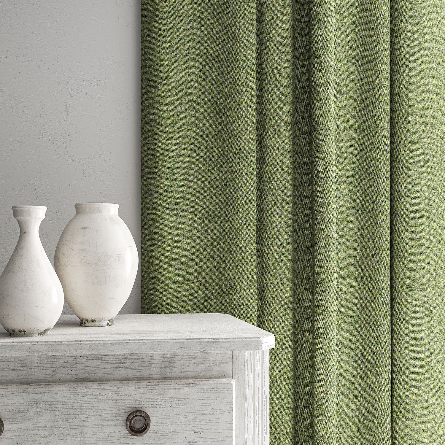 Green curtain made from a plain pure wool woven fabric.