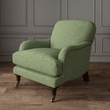 Green chair upholstered in a plain pure wool woven fabric.