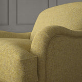 Yellow chair upholstered in a plain pure wool woven fabric.