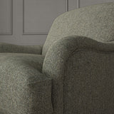 Grey chair upholstered in a plain pure wool woven fabric.