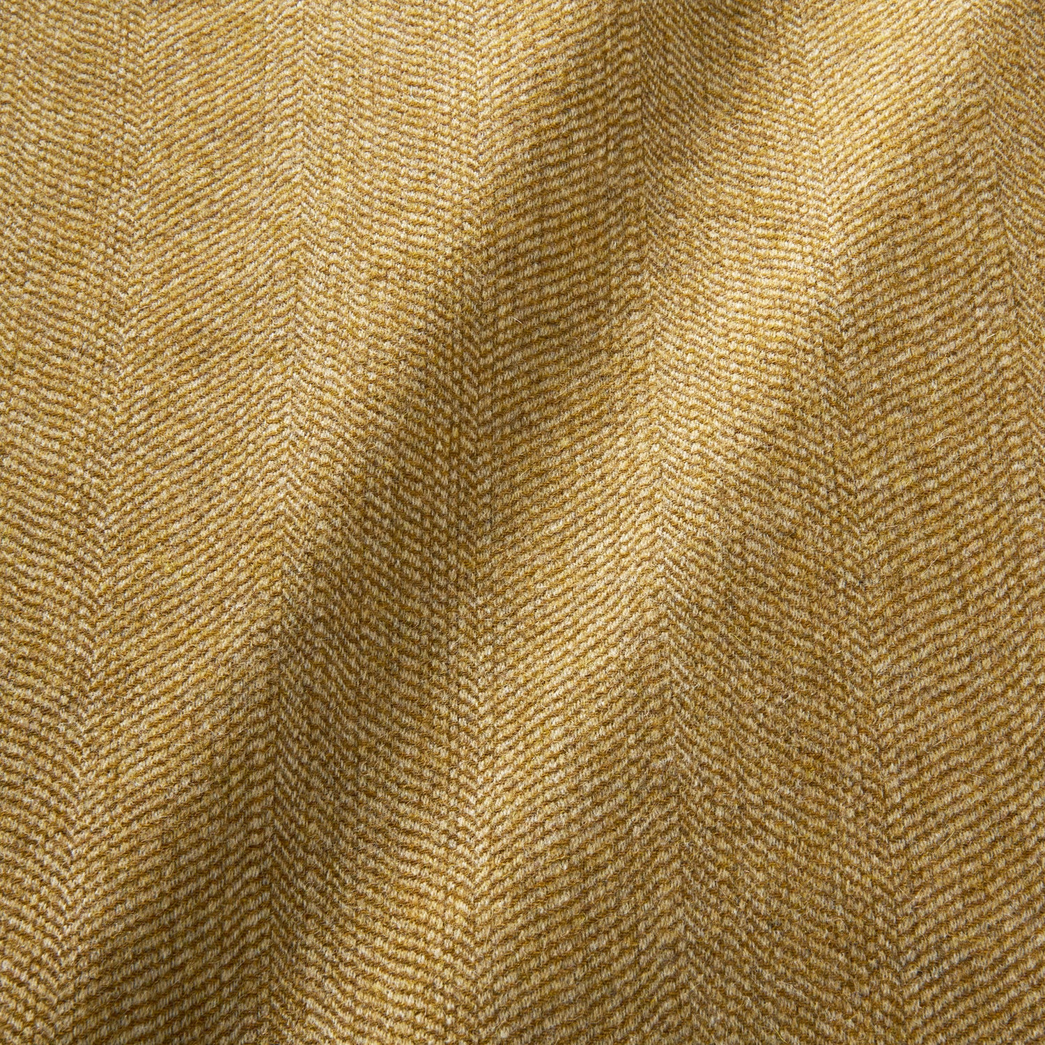 Sample of a classic herringbone woven fabric in yellow.