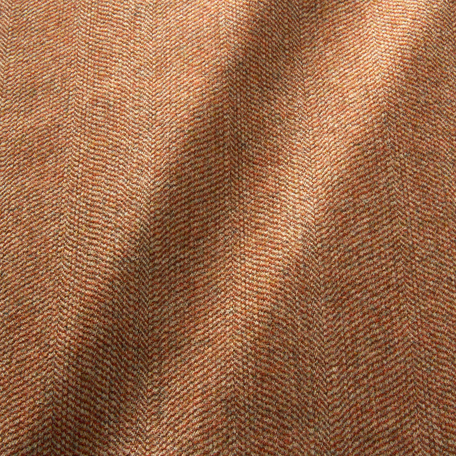 Sample of a classic herringbone woven fabric in orange.