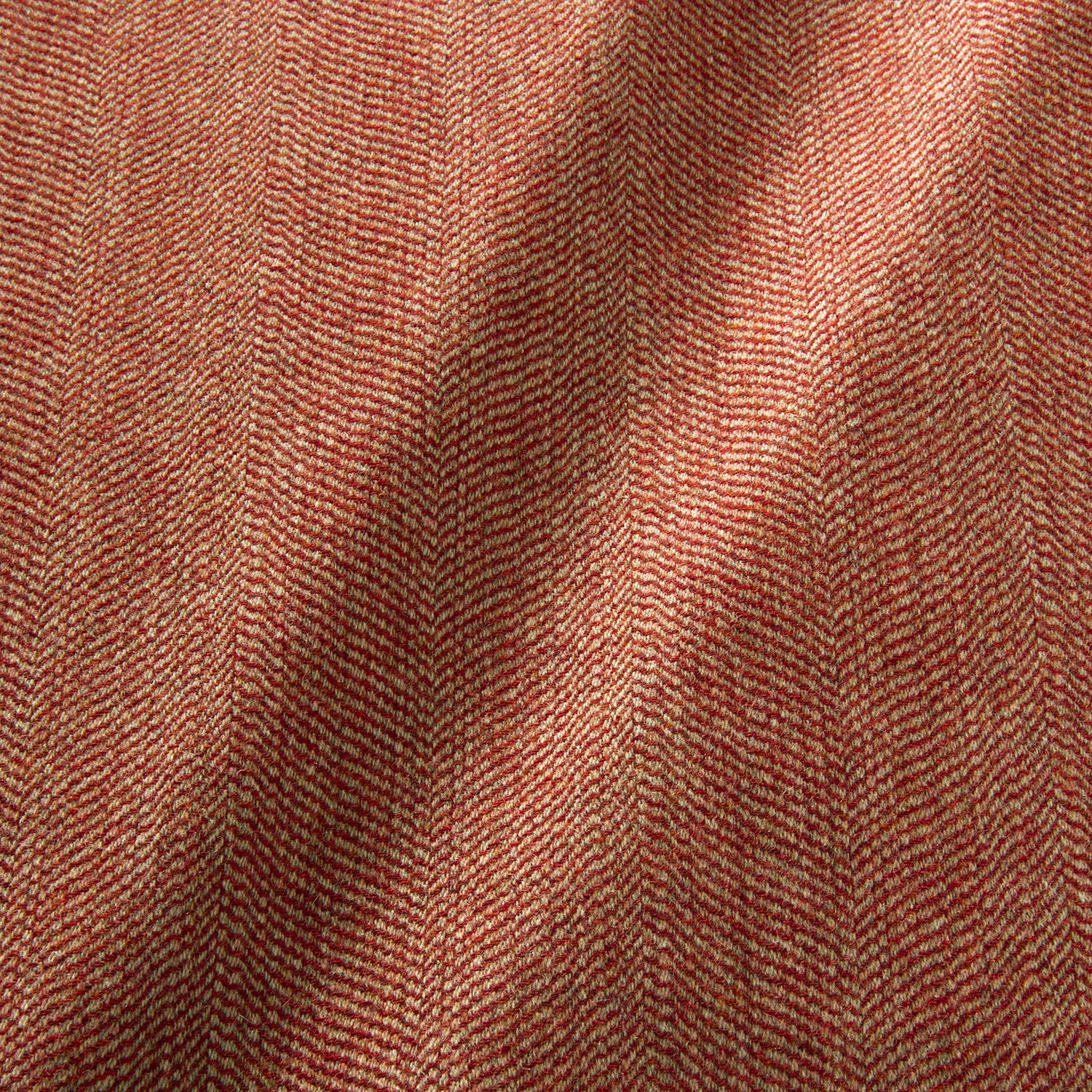 Sample of a classic herringbone woven fabric in red.