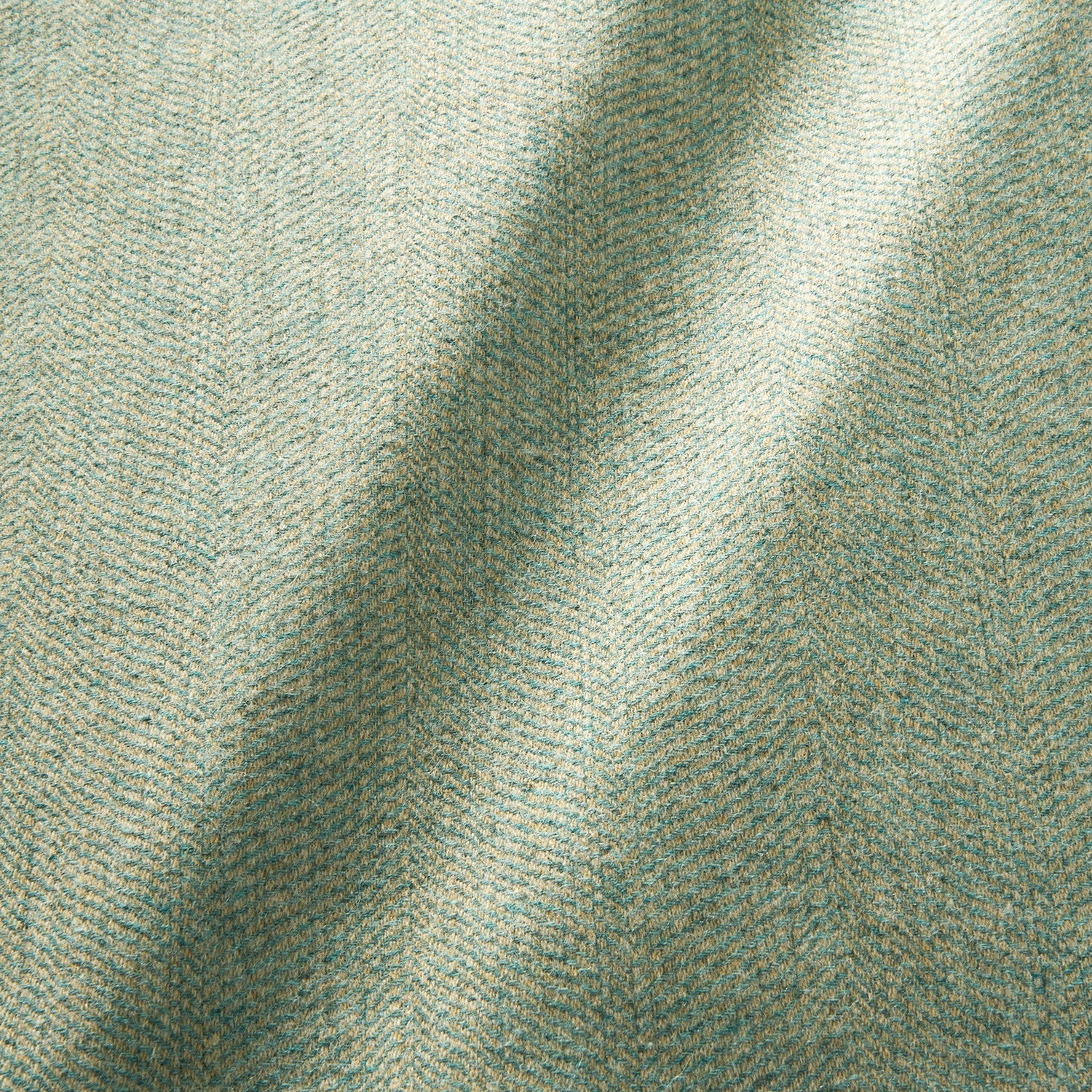 Sample of a classic herringbone woven fabric in blue.