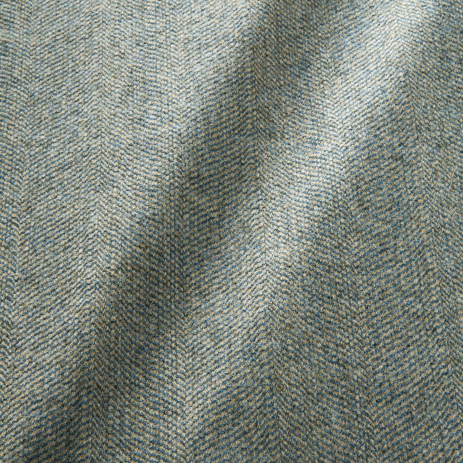 Sample of a classic herringbone woven fabric in blue.