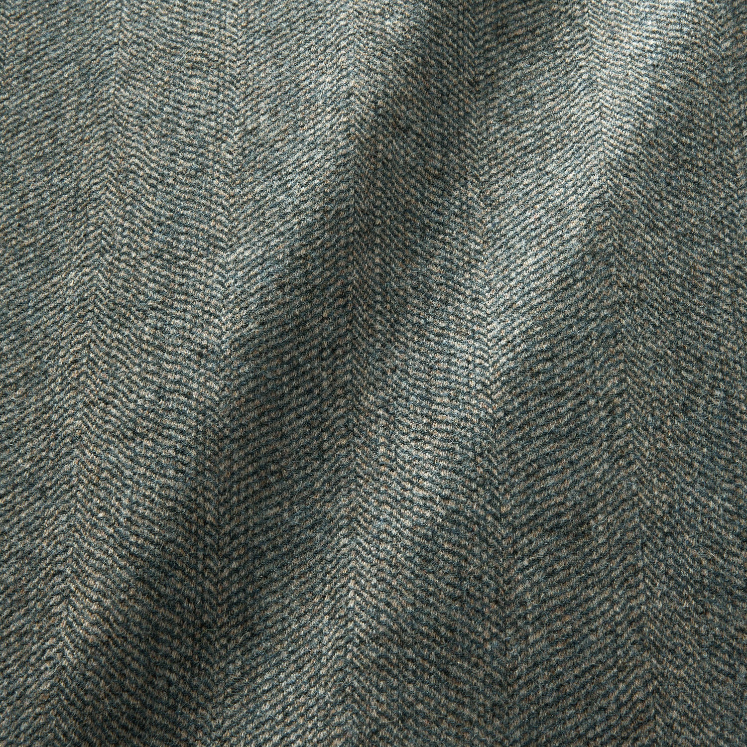 Sample of a classic herringbone woven fabric in blue.