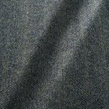 Sample of a classic herringbone woven fabric in blue.