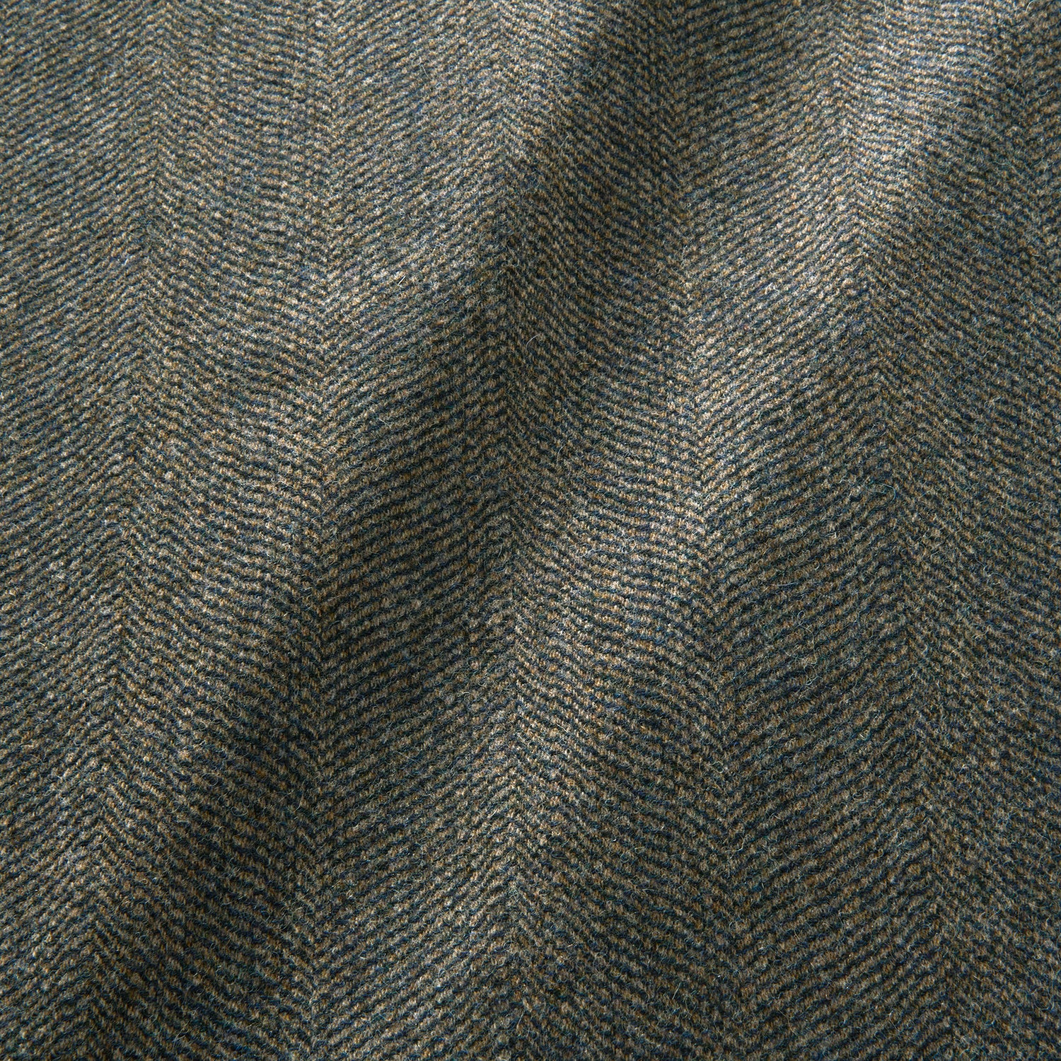 Sample of a classic herringbone woven fabric in blue.