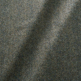 Sample of a classic herringbone woven fabric in blue.