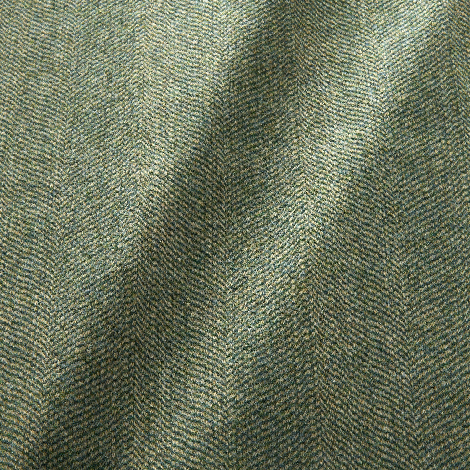 Sample of a classic herringbone woven fabric in green.