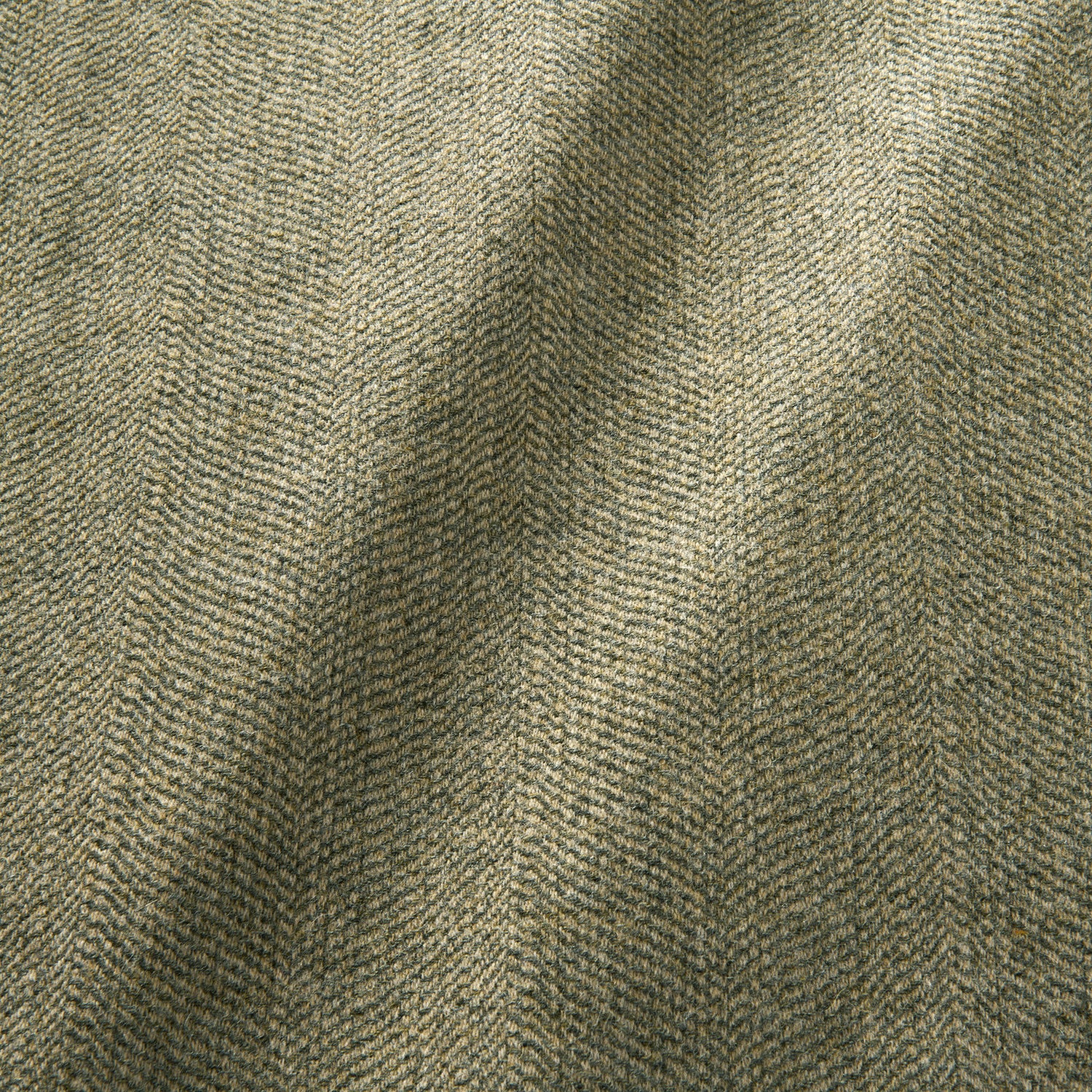 Sample of a classic herringbone woven fabric in grey.