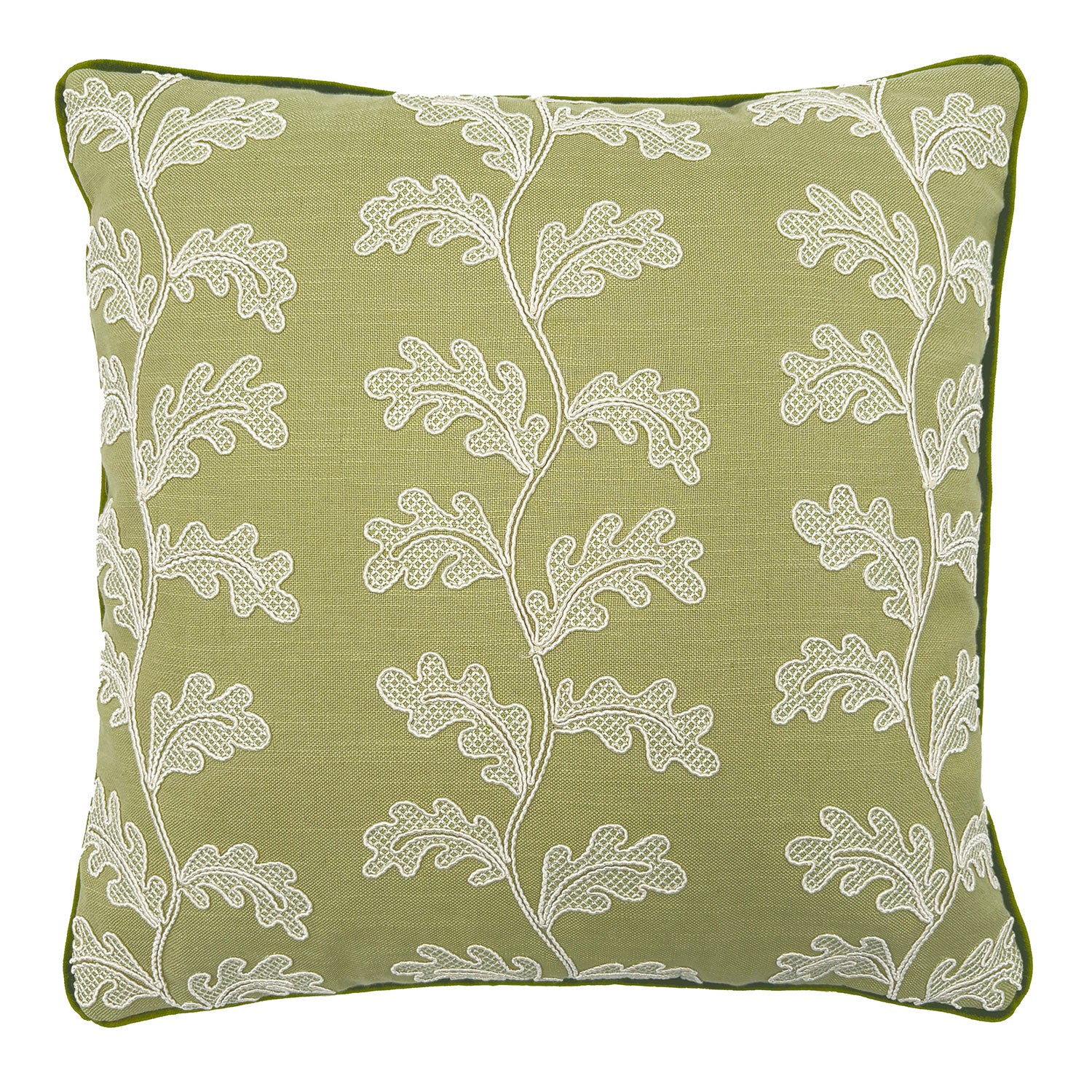 Green embroidered cushion with white leaf pattern.