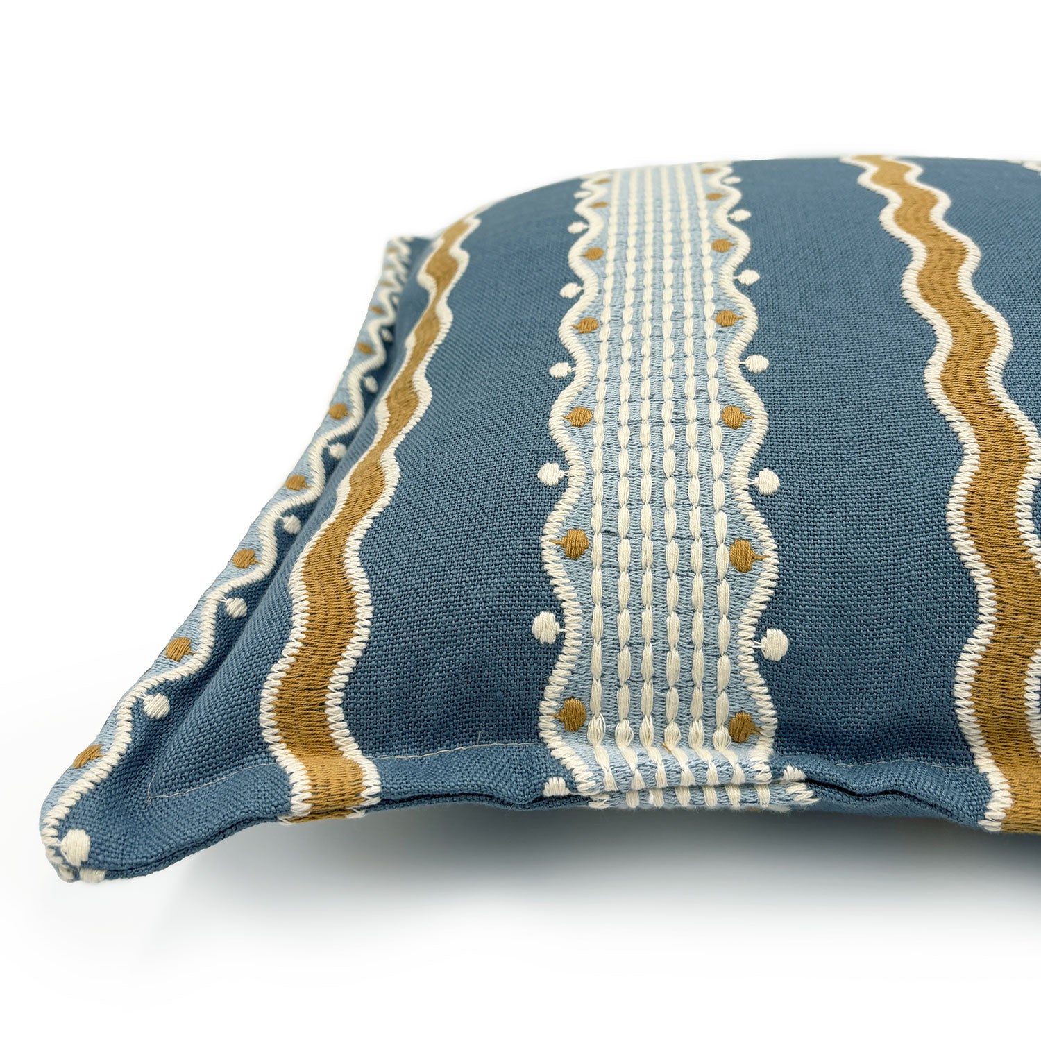 Decorative pillow with blue, gold, and white striped pattern.