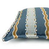 Decorative pillow with blue, gold, and white striped pattern.
